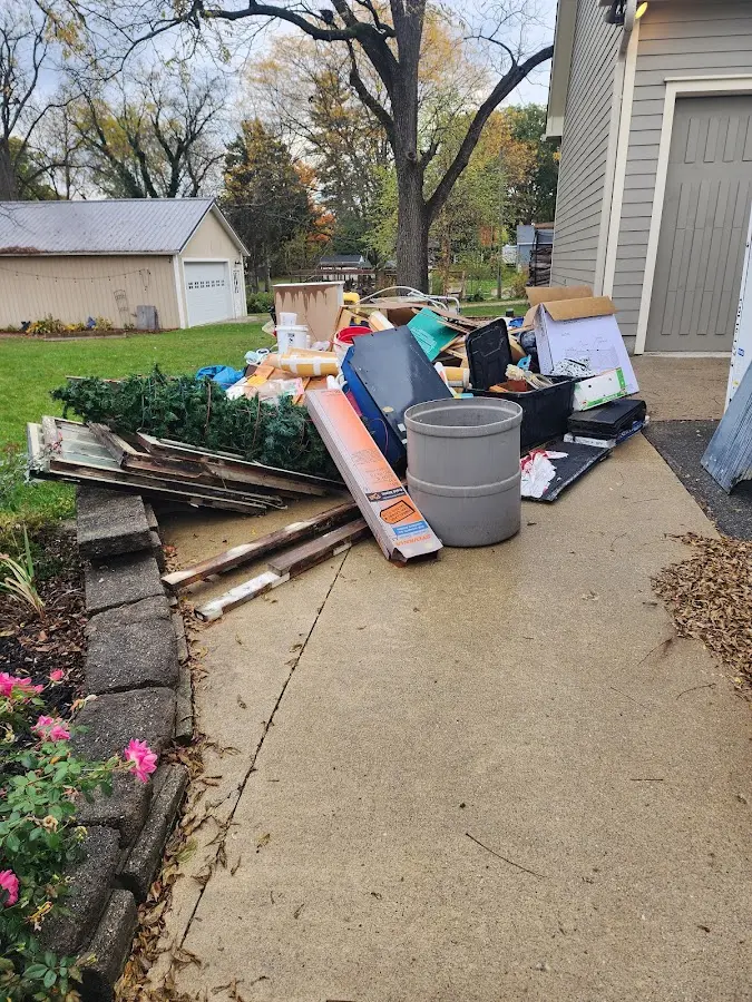 Dumpster being loaded with debris for 10 Yard Dumpster Rental in Sharpsville